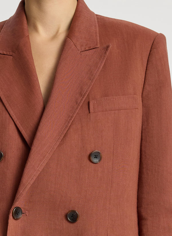 detail view of woman wearing brown short suit