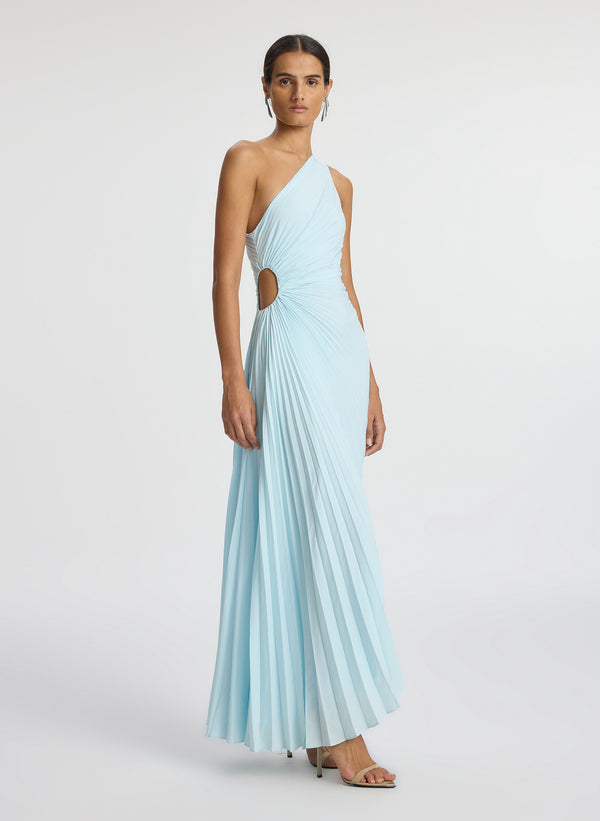 side view of woman wearing aqua pleated one shoulder dress