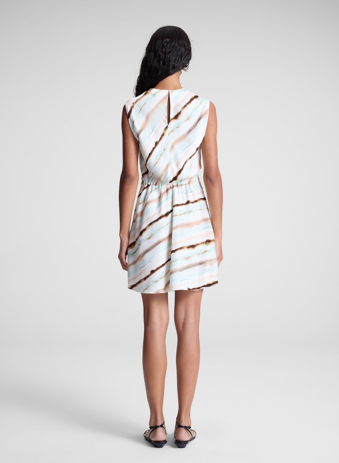 woman wearing striped mini dress