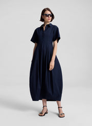 woman wearing navy blue midi dress