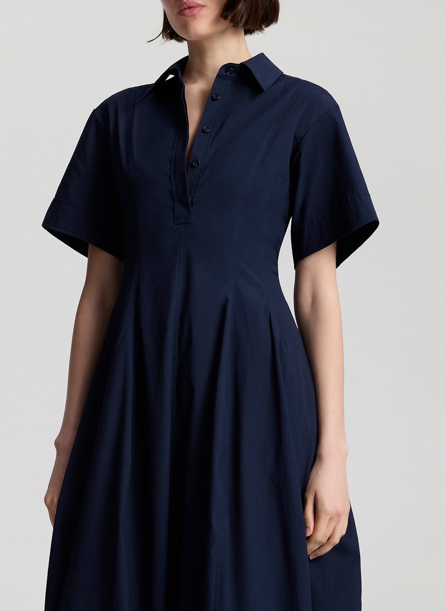 woman wearing navy blue midi dress