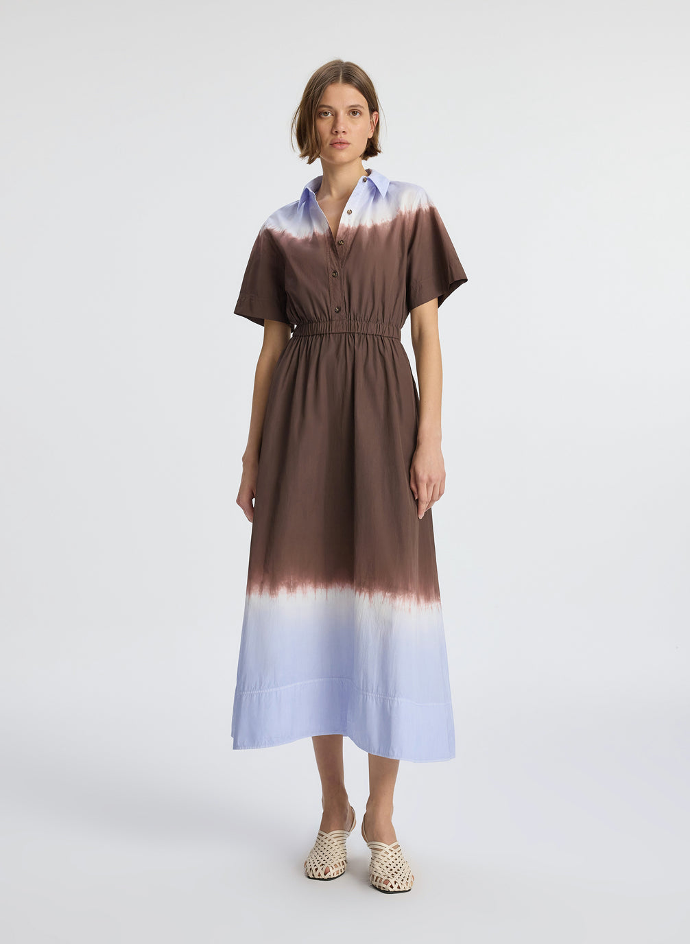front  view of woman wearing brown and light blue dip dye shirtdress