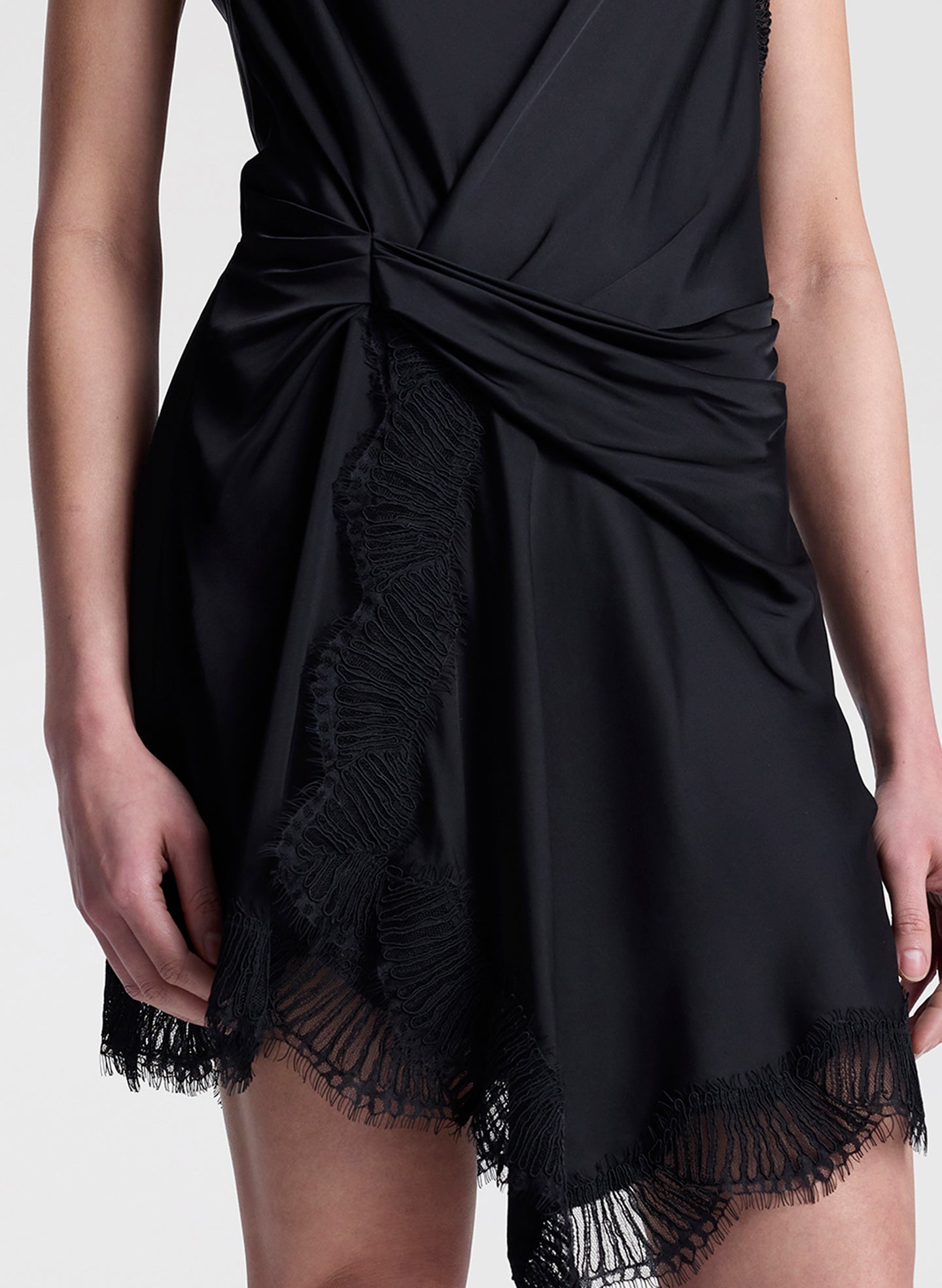woman wearing black satin and lace mini dress