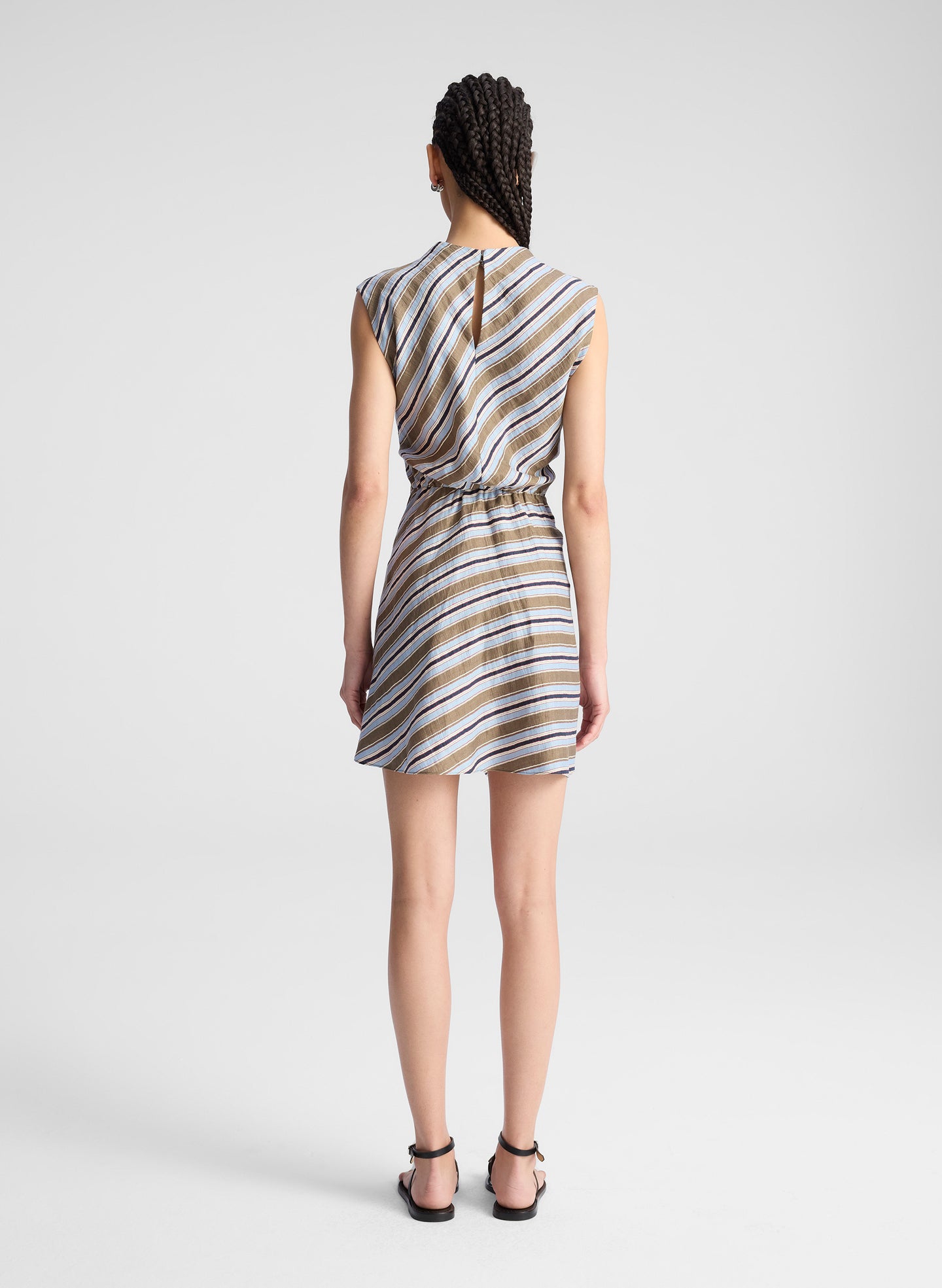 woman wearing striped mini dress