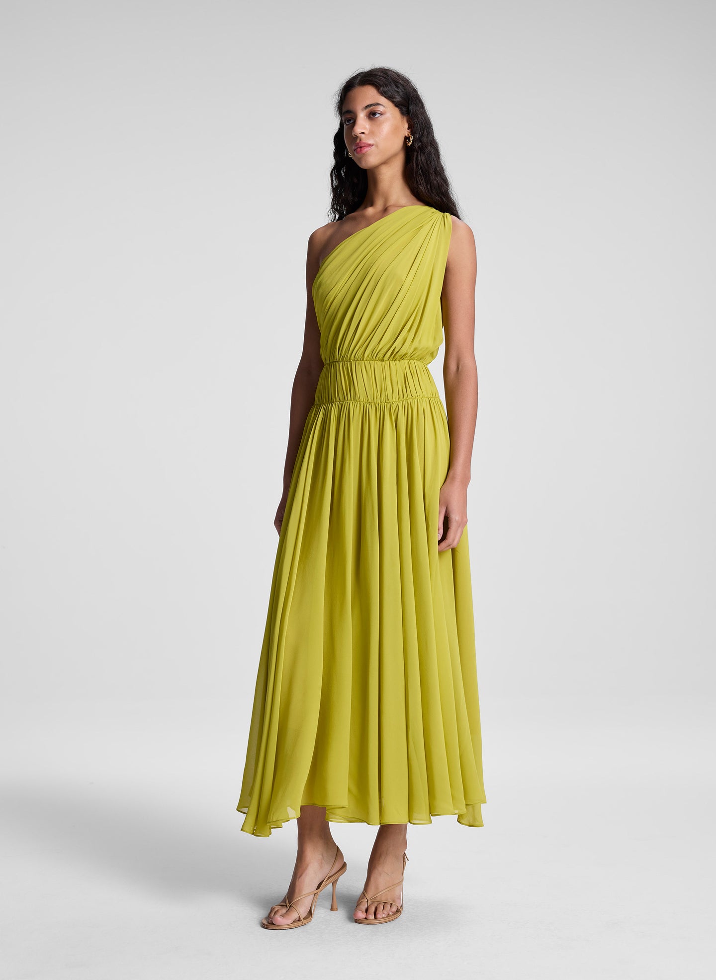 woman wearing green one shoulder midi dress