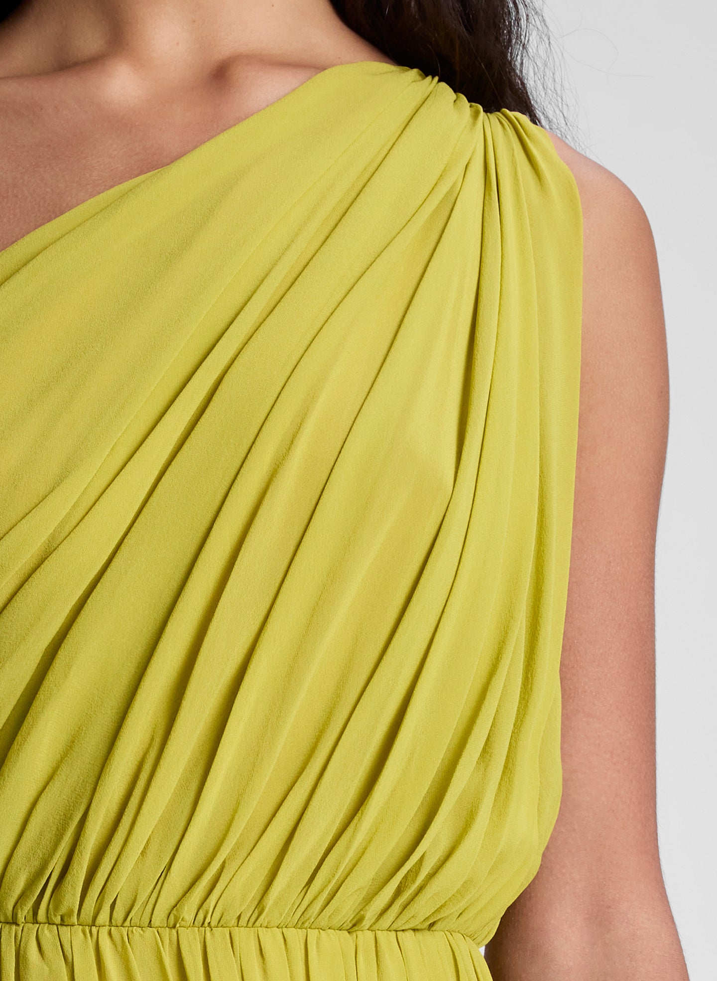 woman wearing green one shoulder midi dress