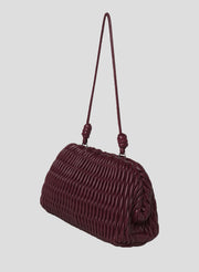 burgundy quilted faux leather handbag