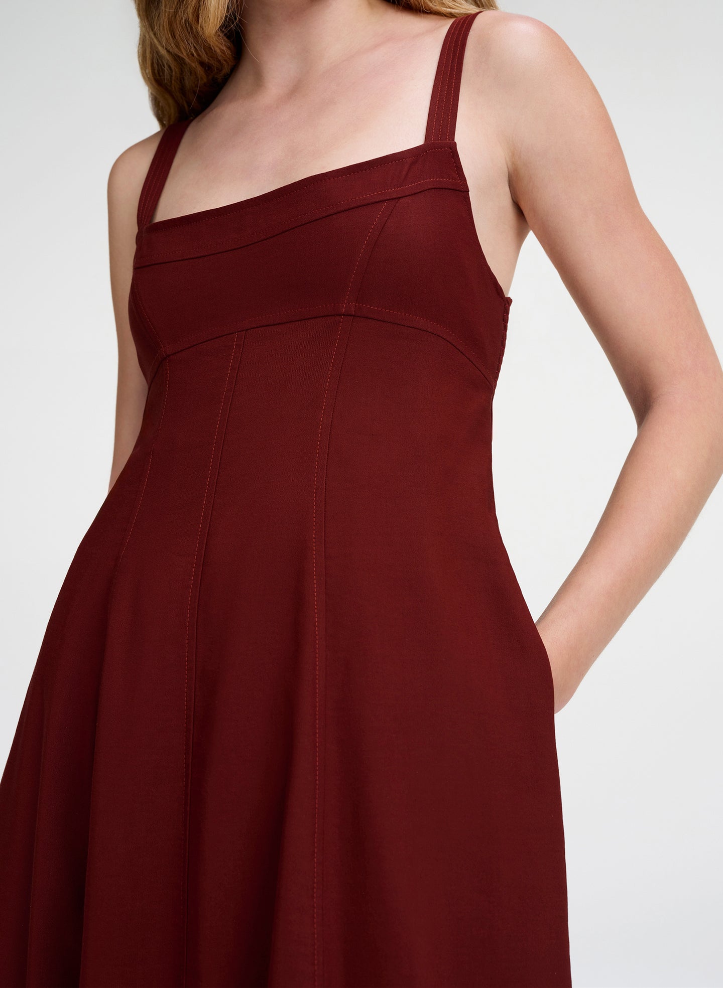 woman in maroon linen midi dress