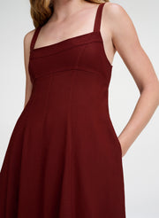 woman in maroon linen midi dress