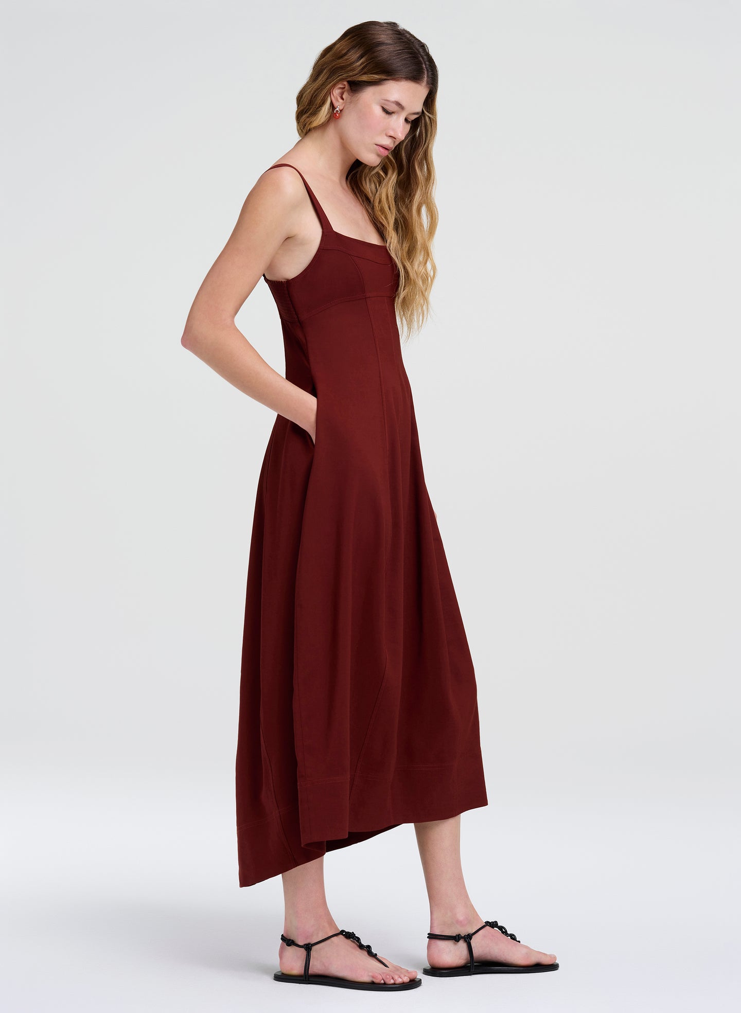woman in  maroon midi dress