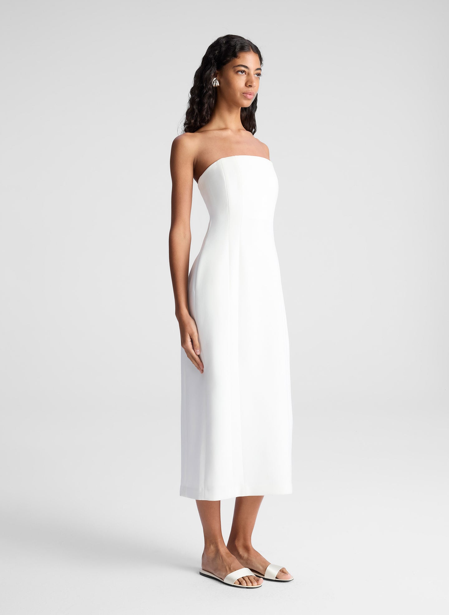 woman wearing white strapless midi dress