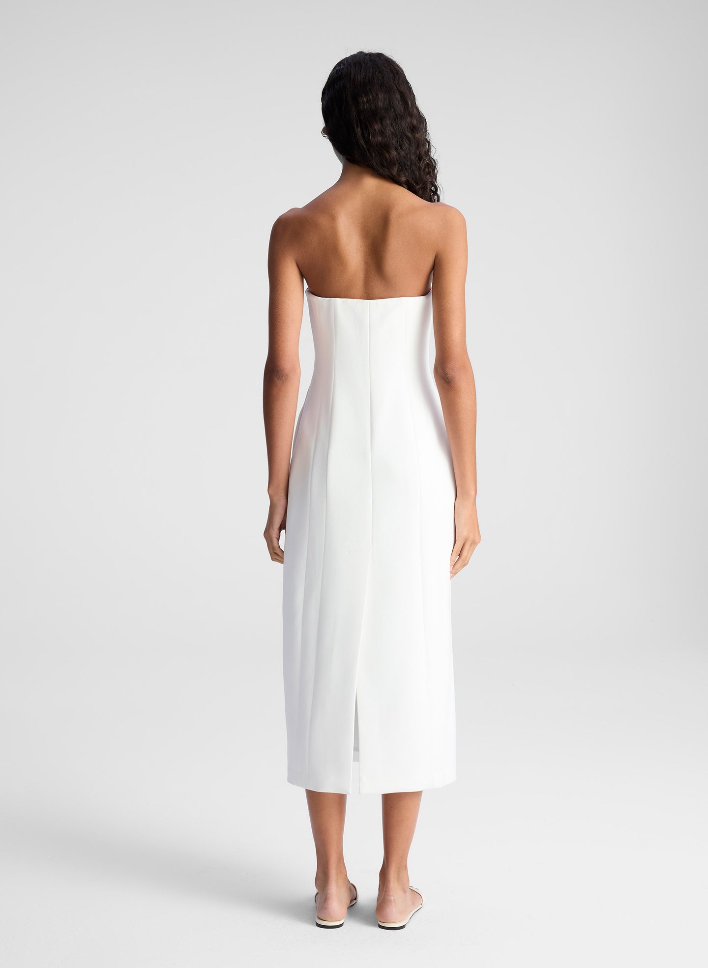 woman wearing white strapless midi dress