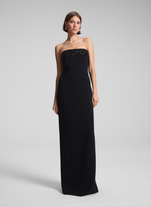 woman wearing black strapless embellished gown