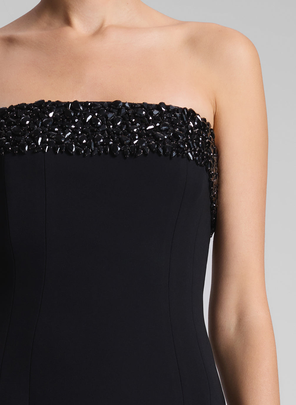 woman wearing black strapless embellished gown