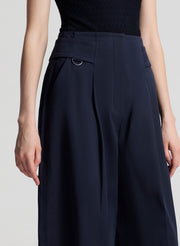 woman wearing black top and navy blue pants