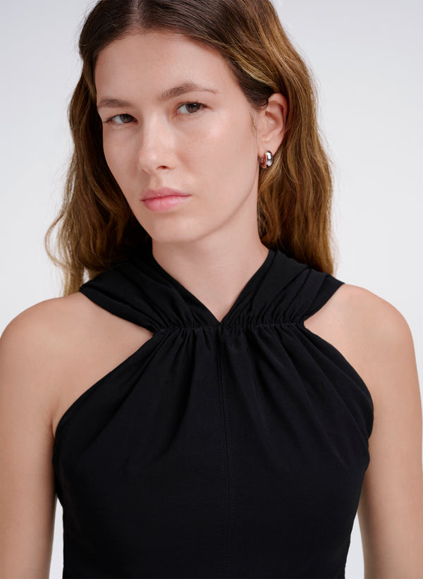 detail of woman in black top