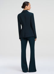 woman wearing dark green suit