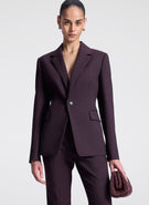 woman wearing purple suit