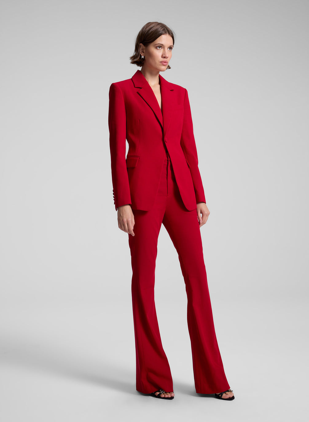 woman wearing red suit