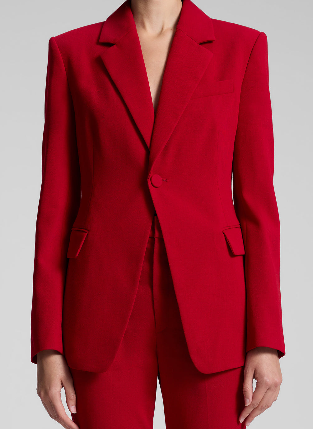 woman wearing red suit