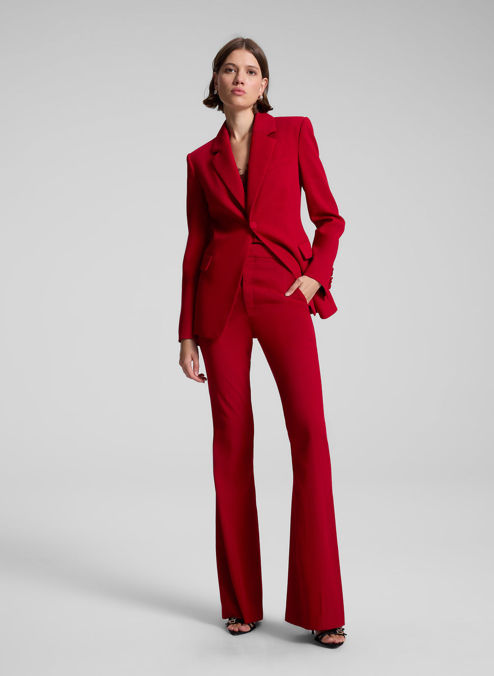 woman wearing red suit