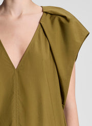 woman wearing green mini dress