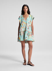 woman wearing aqua abstract printed mini dress