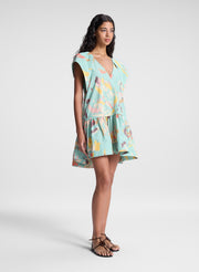 woman wearing aqua abstract printed mini dress