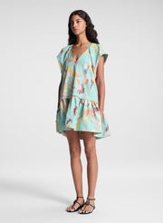 woman wearing aqua abstract printed mini dress