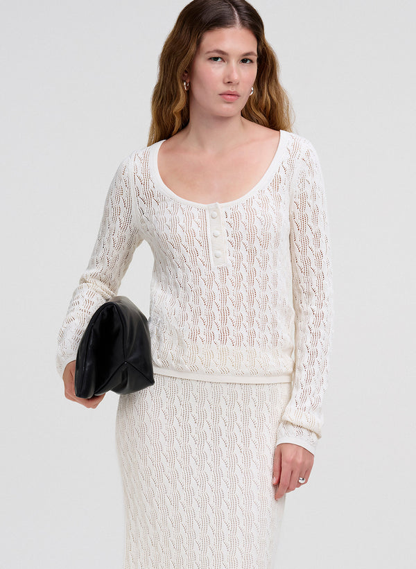 woman in cream knit set