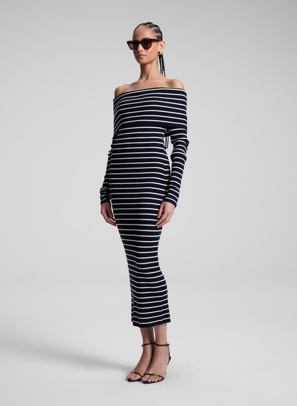 woman wearing navy blue and white striped off shoulder dress