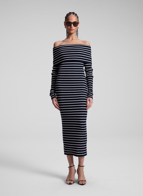 woman wearing navy blue and white striped off shoulder dress