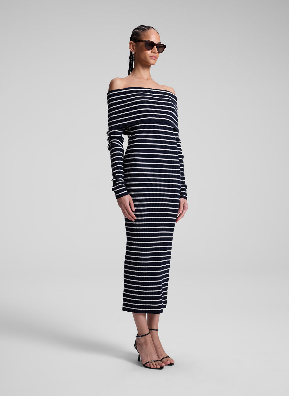 woman wearing navy blue and white striped off shoulder dress