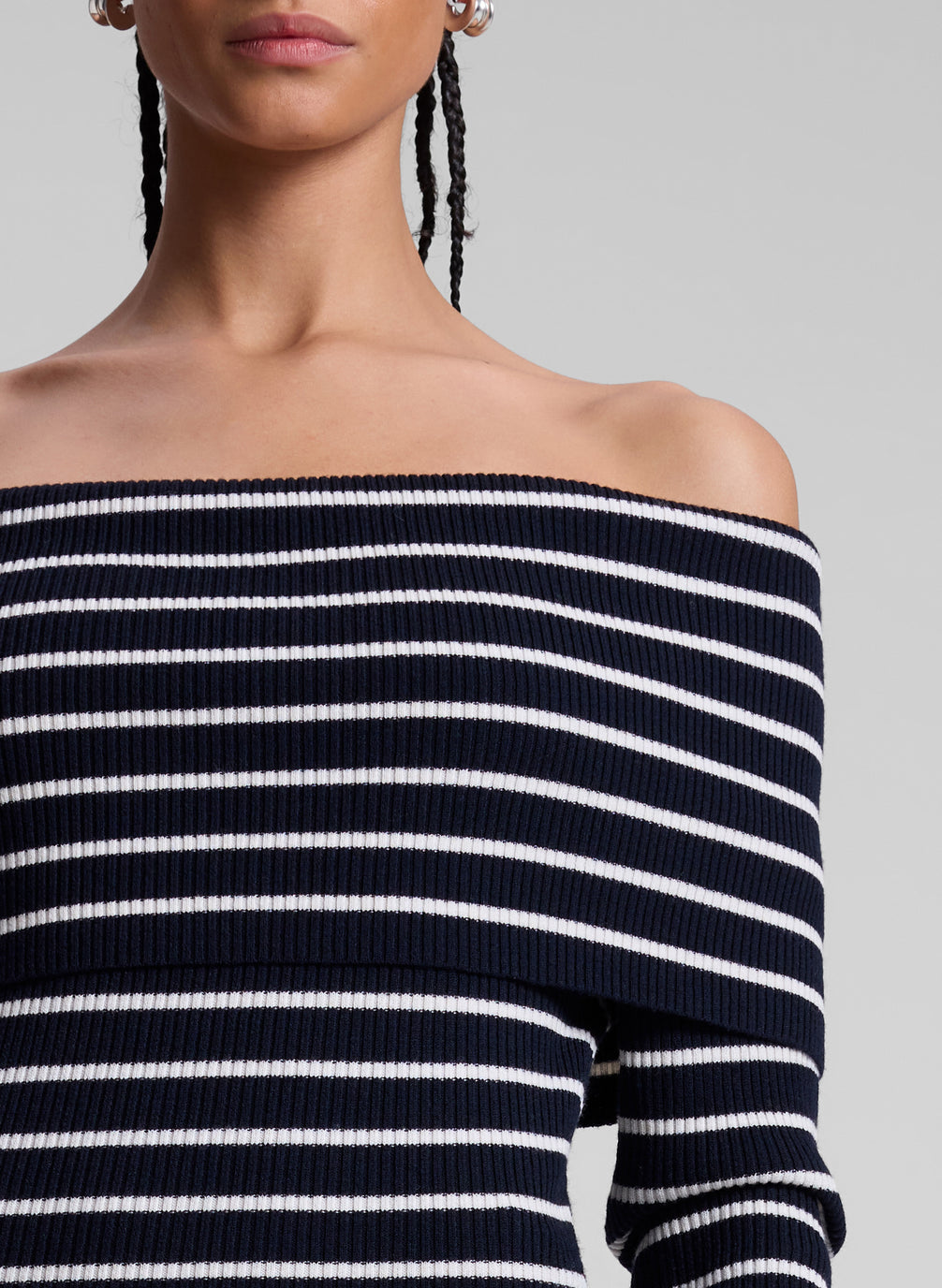 woman wearing navy blue and white striped off shoulder dress