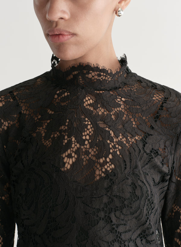 woman wearing black lace mini dress