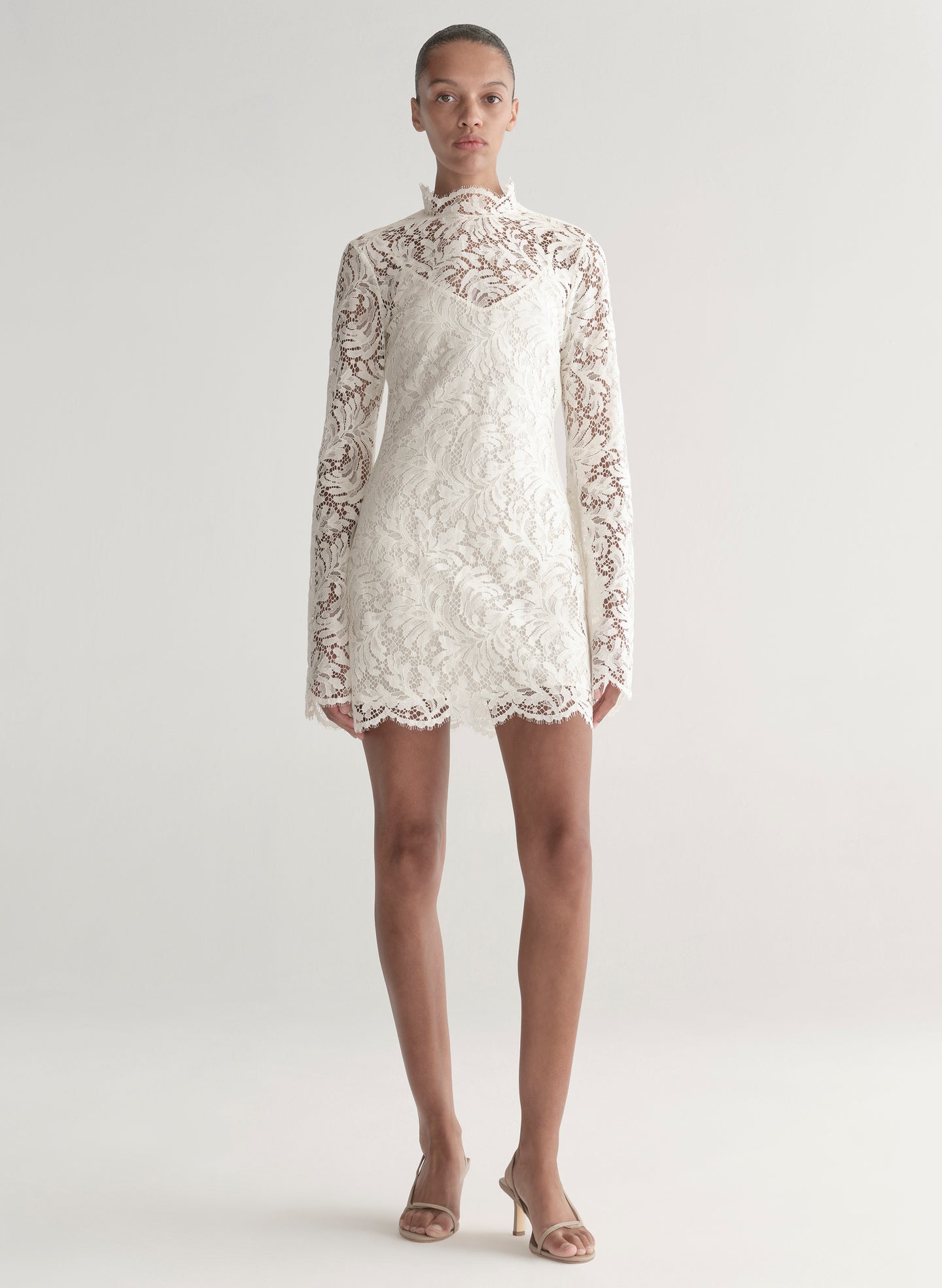 woman wearing white lace mini dress