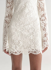 woman wearing white lace mini dress