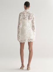 woman wearing white lace mini dress
