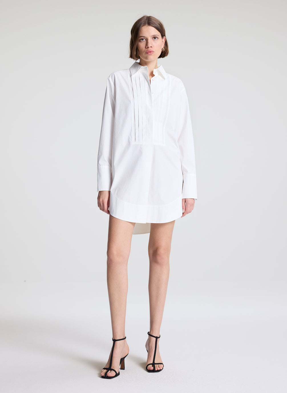 woman wearing white shirtdress