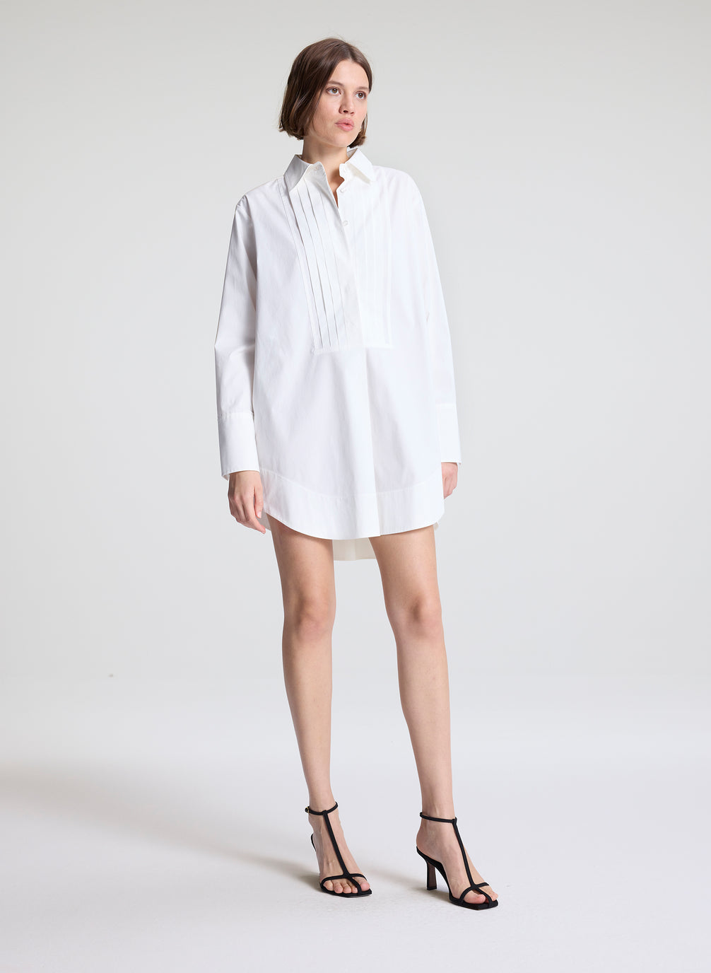 woman wearing white shirtdress