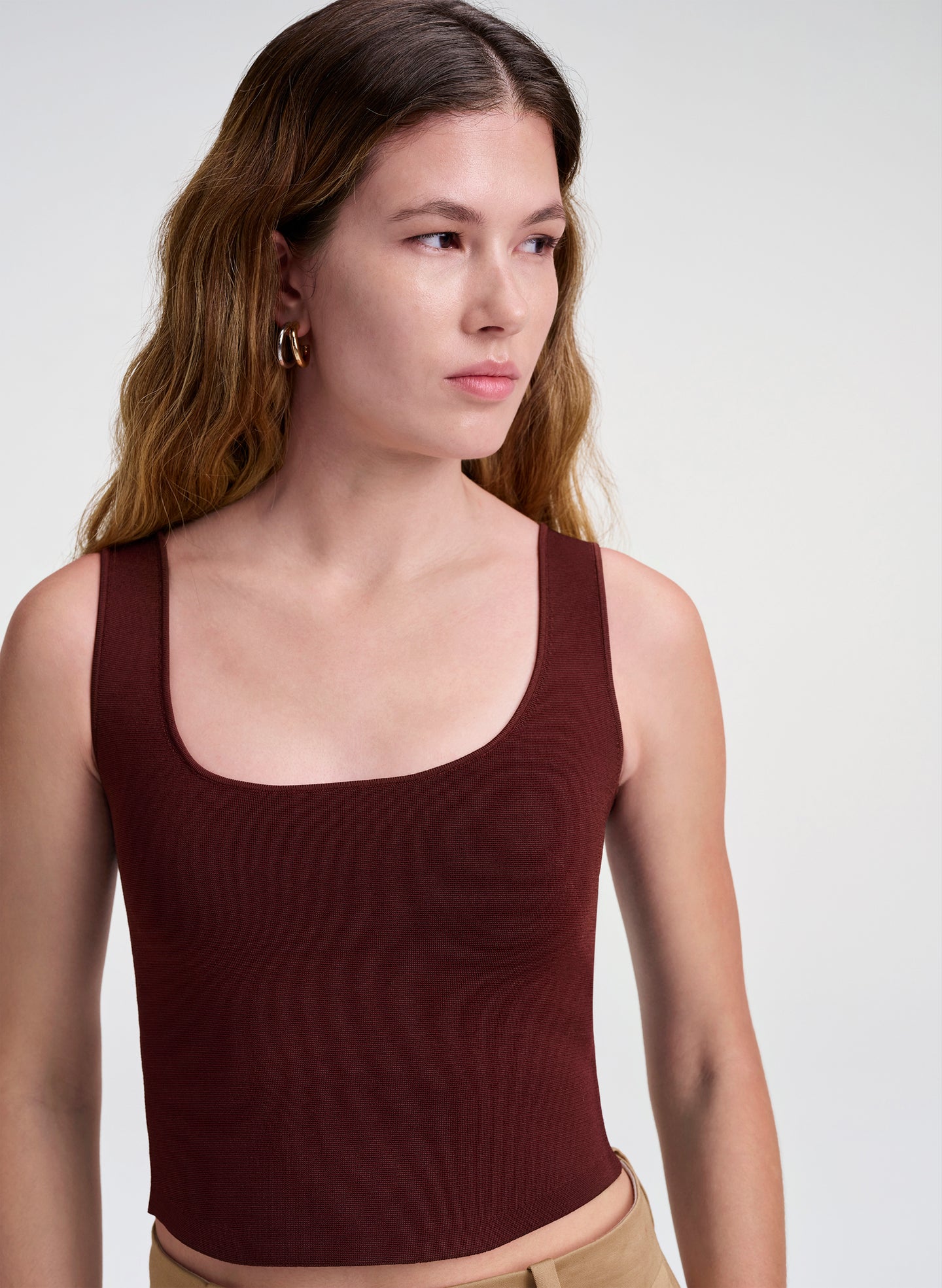 woman wearing maroon tank top