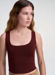 woman wearing maroon tank top