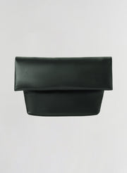 A dark green leather clutch bag with a wide top flap and a structured rectangular body, shown against a plain light gray background.