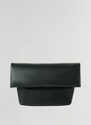 A dark green leather clutch bag with a wide top flap and a structured rectangular base, shown against a plain light gray background.