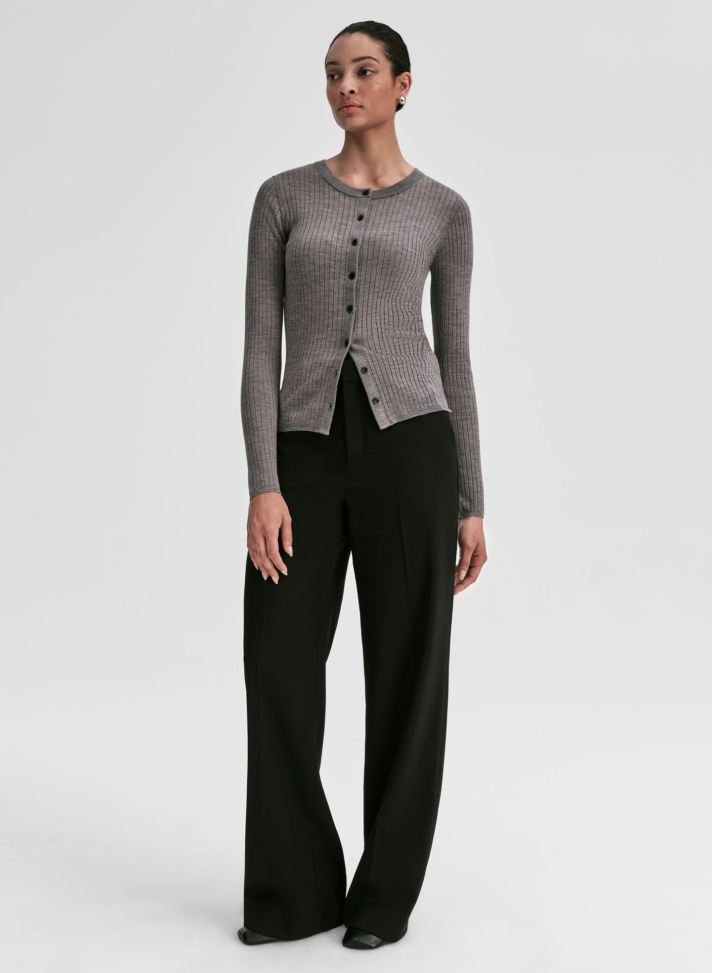 woman wearing grey ribbed cardigan and black pants
