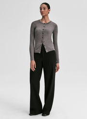 woman wearing grey ribbed cardigan and black pants