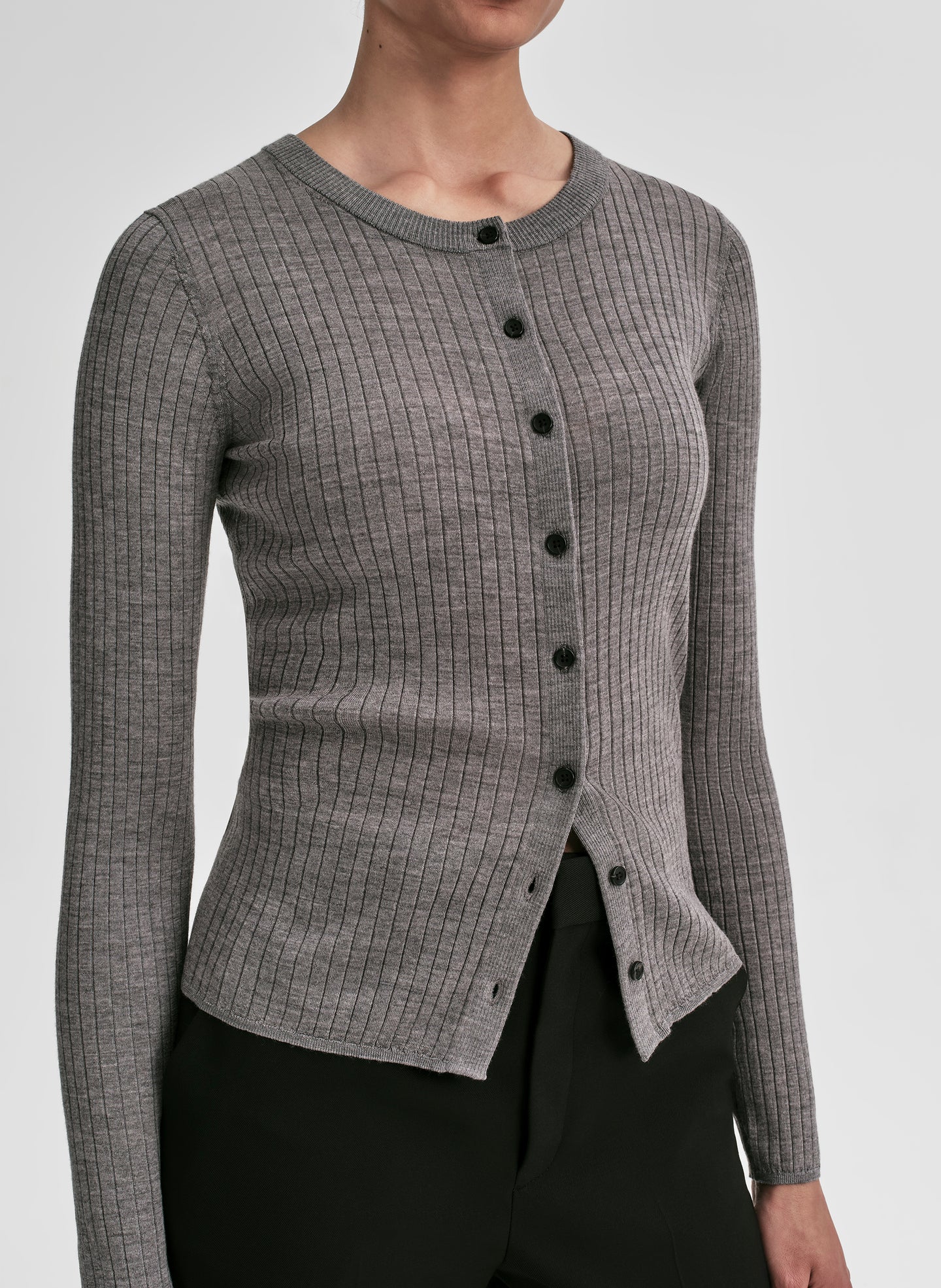 woman wearing grey ribbed cardigan and black pants