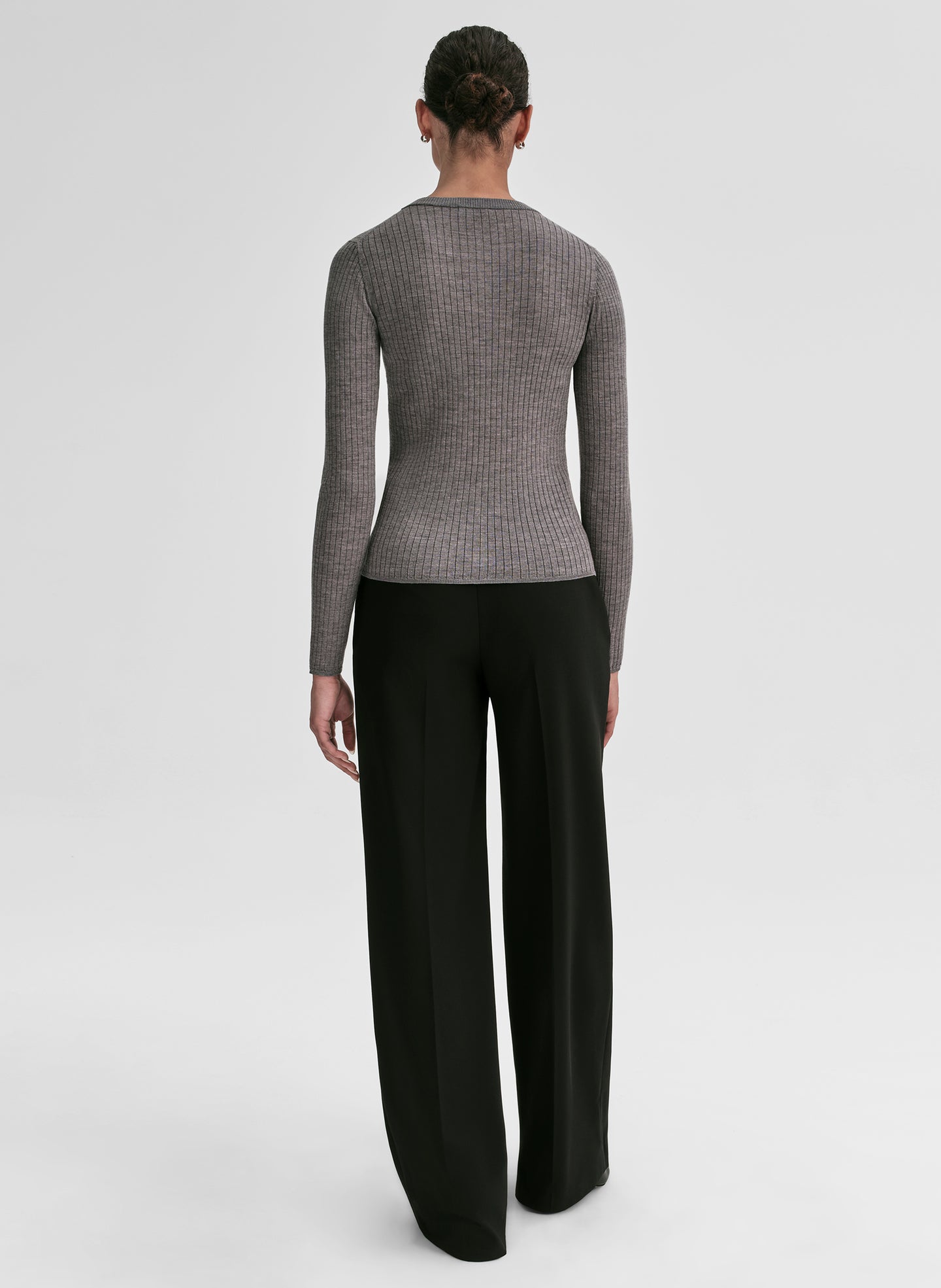 woman wearing grey ribbed cardigan and black pants