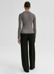 woman wearing grey ribbed cardigan and black pants
