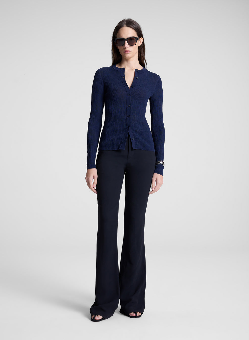 woman wearing navy blue cardigan an navy blue pants